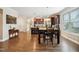 Bright and spacious kitchen and dining area with hardwood floors and a view of the kitchen island at 33 Village Walk Dr, Chapel Hill, NC 27517