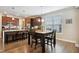 Well-lit kitchen with wooden cabinets, stainless steel appliances, granite countertops, and breakfast table at 33 Village Walk Dr, Chapel Hill, NC 27517