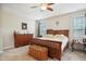 Bedroom featuring natural light, carpet flooring, trey ceiling with fan, and wooden furniture at 33 Village Walk Dr, Chapel Hill, NC 27517