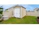 The backyard boasts a convenient storage shed with a light brown exterior and contrasting white doors at 33 Village Walk Dr, Chapel Hill, NC 27517
