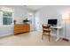 Bedroom with neutral walls, carpet floors, and desk at 3901 Phlox Rd, Raleigh, NC 27616