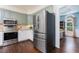 Modern kitchen with stainless steel appliances, including a large refrigerator at 3901 Phlox Rd, Raleigh, NC 27616