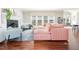 Spacious living room with fireplace, hardwood floors, and large windows at 3901 Phlox Rd, Raleigh, NC 27616
