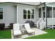 Outdoor living space featuring a patio with lounge chairs, a grill, and a screened porch at 4104 Green Chase Way, Apex, NC 27539