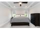 This calming bedroom offers a tray ceiling and a ceiling fan, ensuring a comfortable environment at 4104 Green Chase Way, Apex, NC 27539