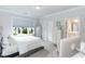 Light and airy bedroom featuring a large window, dresser, and a comfortable bed with white linens at 4104 Green Chase Way, Apex, NC 27539