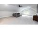 Large bonus room with vaulted ceiling, comfortable seating, and built-in shelves and bench seat at 4104 Green Chase Way, Apex, NC 27539