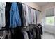 Spacious walk-in closet with custom shelving, offering ample storage space for your wardrobe at 4104 Green Chase Way, Apex, NC 27539