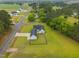 High angle showcasing a home, fenced in backyard, and a long driveway on a large lot at 416 Fred Tew Rd, Dunn, NC 28334