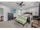 Spacious bedroom with neutral carpet, ceiling fan, and classic furniture including a dark wood bed at 416 Fred Tew Rd, Dunn, NC 28334