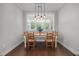 Charming dining room featuring hardwood floors, natural light, and a rustic wooden table set at 416 Fred Tew Rd, Dunn, NC 28334