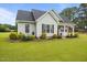 Charming single-story home with manicured lawn, tidy landscaping, and a welcoming front porch at 416 Fred Tew Rd, Dunn, NC 28334