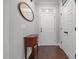 Welcoming foyer with hardwood floors, decorative mirror, and access to coat closet at 416 Fred Tew Rd, Dunn, NC 28334