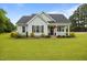 Charming single-story home with manicured lawn, tasteful landscaping, and an inviting covered porch at 416 Fred Tew Rd, Dunn, NC 28334