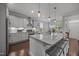Beautiful kitchen island with pendant lighting, granite countertops, and barstool seating at 416 Fred Tew Rd, Dunn, NC 28334