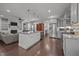 Open kitchen and living area with an island, stainless steel appliances, and hardwood flooring at 416 Fred Tew Rd, Dunn, NC 28334