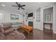 Inviting living room with built-in shelving, a fireplace, and hardwood floors at 416 Fred Tew Rd, Dunn, NC 28334
