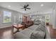Open-concept living room and kitchen area featuring hardwood floors and natural light at 416 Fred Tew Rd, Dunn, NC 28334