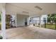 A covered parking area with concrete flooring, lighting, and access to backyard and home at 416 Fred Tew Rd, Dunn, NC 28334