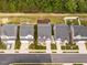 Aerial view of homes in a neighborhood with well-manicured lawns and mature trees at 4179 Dunkirk Dr, Burlington, NC 27215