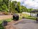 Well-maintained backyard with a patio, lush landscaping, and a cozy outdoor dining area at 4179 Dunkirk Dr, Burlington, NC 27215