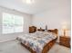 Cozy bedroom with carpet, a large window for natural light, and a comfortable layout for a restful retreat at 4179 Dunkirk Dr, Burlington, NC 27215