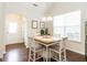 Bright dining area with hardwood floors, a stylish table, and a chandelier at 4179 Dunkirk Dr, Burlington, NC 27215