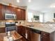 Well-appointed kitchen boasting granite counters, stainless appliances, and open access to the living area for easy interaction at 4179 Dunkirk Dr, Burlington, NC 27215