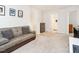 Relaxing sitting area with a comfortable sofa, neutral décor, and an open layout at 4179 Dunkirk Dr, Burlington, NC 27215