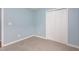 Cozy bedroom with carpet, closet, and light blue walls at 418 Lodestone Dr, Durham, NC 27703