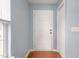Bright entryway featuring hardwood floors, a white front door, and neutral-toned walls at 418 Lodestone Dr, Durham, NC 27703