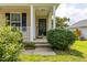 Inviting front porch with classic columns and lush landscaping at 418 Lodestone Dr, Durham, NC 27703