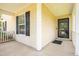Covered front porch featuring neutral siding and a classic front door at 418 Lodestone Dr, Durham, NC 27703