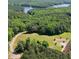A beautiful lot ready for your dream home, surrounded by lush green trees and a peaceful lake at 429 Shinleaf Pond Trl, Raleigh, NC 27614