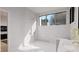 Bright bathroom with dual shower heads, marble tile, and modern vanity at 429 Shinleaf Pond Trl, Raleigh, NC 27614