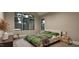 Bright bedroom featuring a large window, neutral tones, and minimalist decor for a serene space at 429 Shinleaf Pond Trl, Raleigh, NC 27614