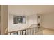 Bright hallway features a stylish staircase and ample natural light from large windows at 429 Shinleaf Pond Trl, Raleigh, NC 27614