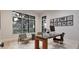 Stylish home office with large windows, modern desk, and comfortable seating at 429 Shinleaf Pond Trl, Raleigh, NC 27614