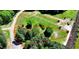 Aerial view of a parcel outlined in red, showcasing its expansive grassy and wooded area with potential at 429 Shinleaf Pond Trl, Raleigh, NC 27614