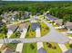 Aerial view showcases a neighborhood with well-manicured lawns and mature trees at 45 Glen Bend Ct, Spring Lake, NC 28390