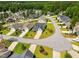 Aerial view showcases a neighborhood with well-manicured lawns and mature trees at 45 Glen Bend Ct, Spring Lake, NC 28390
