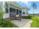 Enclosed back porch with brick base, stairs, concrete patio and decorative privacy screens at 45 Glen Bend Ct, Spring Lake, NC 28390