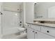 Bathroom with shower and tub combo, and granite countertop sink at 45 Glen Bend Ct, Spring Lake, NC 28390