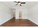 Spacious primary bedroom with tray ceiling, hardwood floors, and ensuite bath access at 45 Glen Bend Ct, Spring Lake, NC 28390