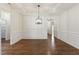 Bright dining room featuring hardwood floors, wainscoting, and a stylish light fixture at 45 Glen Bend Ct, Spring Lake, NC 28390