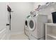 Laundry room featuring washer and dryer, and wire shelves for storage at 45 Glen Bend Ct, Spring Lake, NC 28390