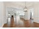 Open concept living space featuring wood floors, fireplace, and kitchen with a view of the outdoor scenery at 45 Glen Bend Ct, Spring Lake, NC 28390