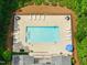 Aerial view of community pool with lounge chairs and umbrellas surrounded by trees at 45 Glen Bend Ct, Spring Lake, NC 28390