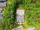 An aerial view showing a community pool, clubhouse, lounge chairs, and the lush greenery of the landscaping at 45 Glen Bend Ct, Spring Lake, NC 28390