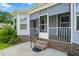 Enclosed porch with brick base, stairs and decorative privacy screens, with outdoor entrance at 45 Glen Bend Ct, Spring Lake, NC 28390